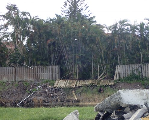 Downed fencing E-3 Canal in area of SW 18th Street