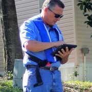 Inspector Gunther using tablet for data collection