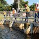 Men working at water control structure