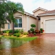 HOme with flooding in street and front yard