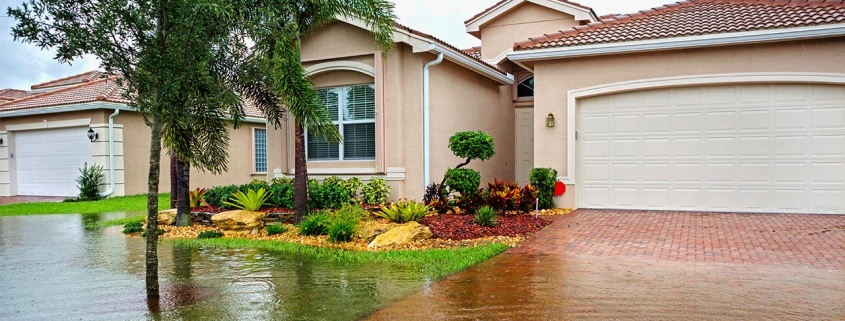 HOme with flooding in street and front yard