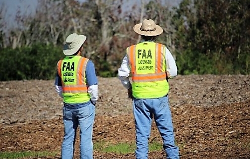 2 men standing in a field