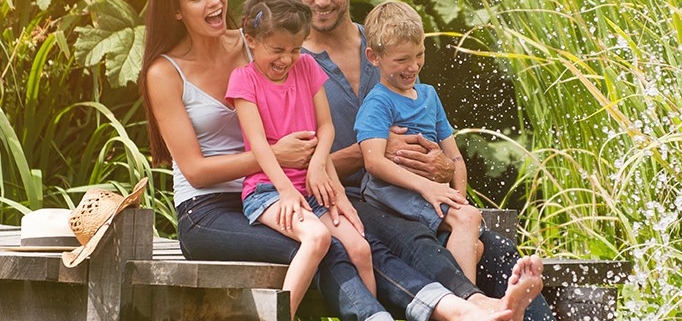 Parents and children by canal