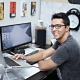 person seated at a computer desk