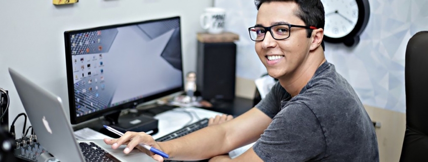 person seated at a computer desk