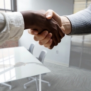 black and white men shaking hands