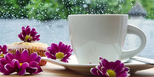 Coffee cup with flower on a table