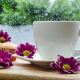 Coffee cup with flower on a table