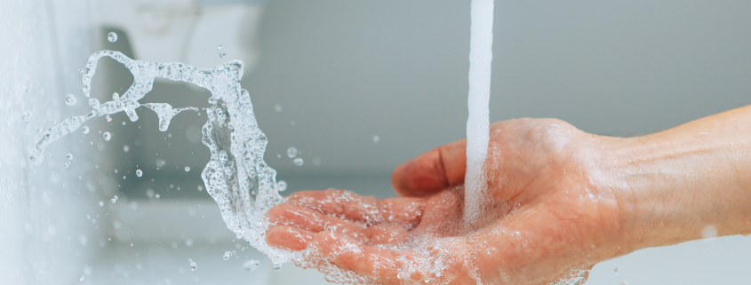 Hand under running water